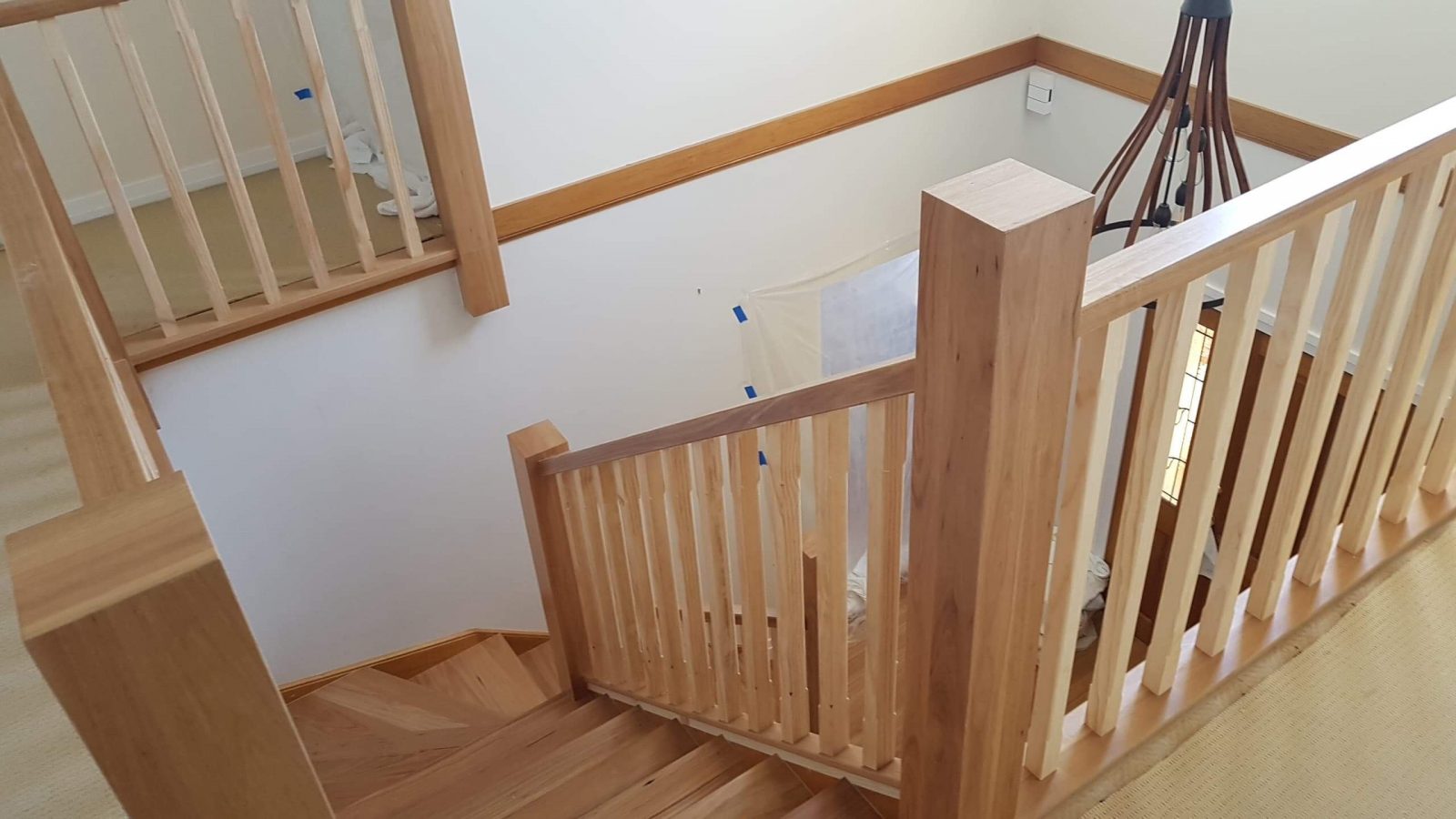 Our Designer Staircase and hardwood timber flooring compliment each other for a sophisticated example of modern living. Customised Baluster, Newell Posts and handrail all handmade. Supplied and installed by Timber Floors Pty Ltd